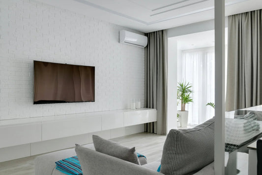 ENERGY STAR mini-split mounted on a white brick wall in a bright modern living room